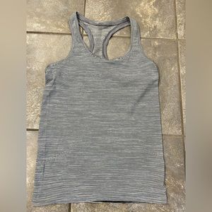 Lululemon black and white swift stride tank. Size 6. Excellent condition.